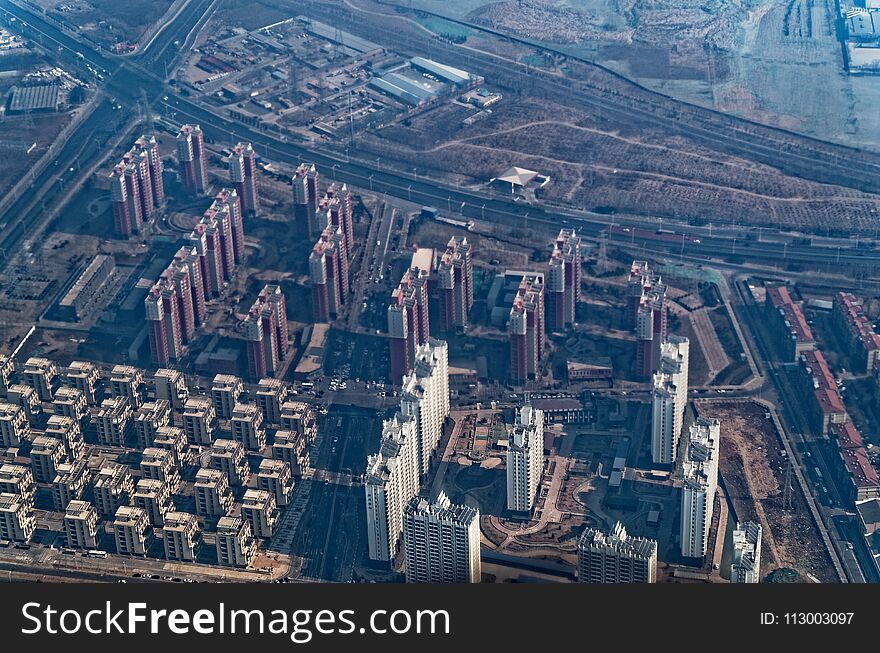 Looking down from an airplane on a buildings in Peking