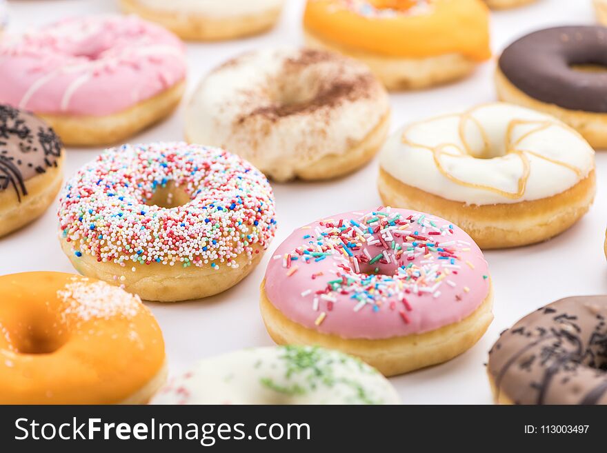 Fresh made Donuts as detailed close-up shots selective focus. Fresh made Donuts as detailed close-up shots selective focus