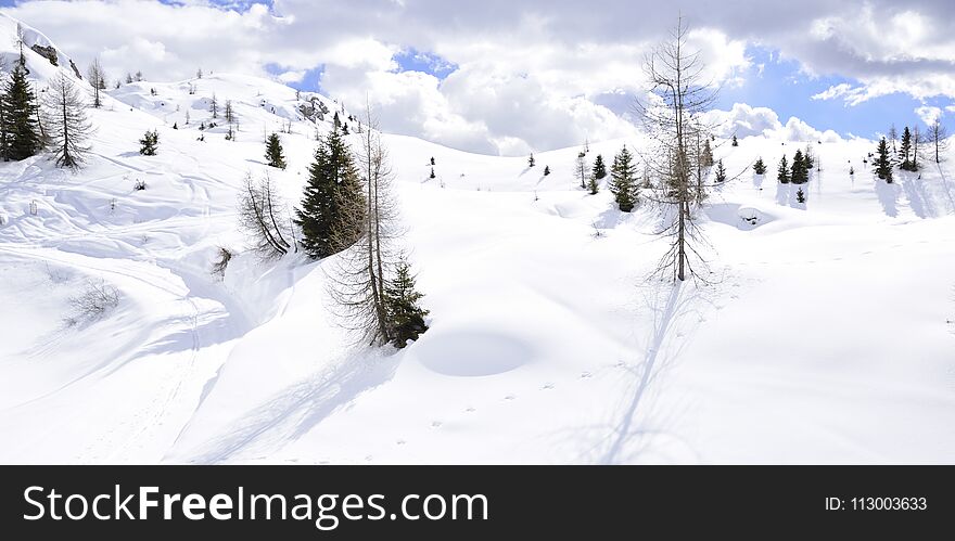The peaks of the Alps in winter with soft snow