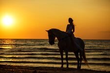 Female Silhouette On A Horse At Sunset By The Sea Stock Photo Female Silhouette On A Horse At Sunset By The Sea Stock Photo