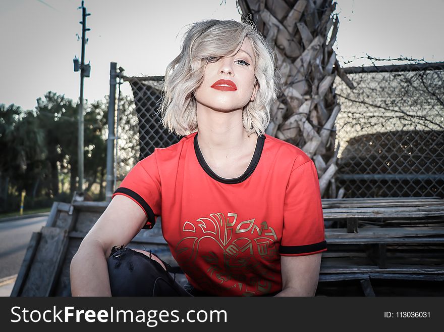 Woman in Red and Black Crew-neck T-shirt