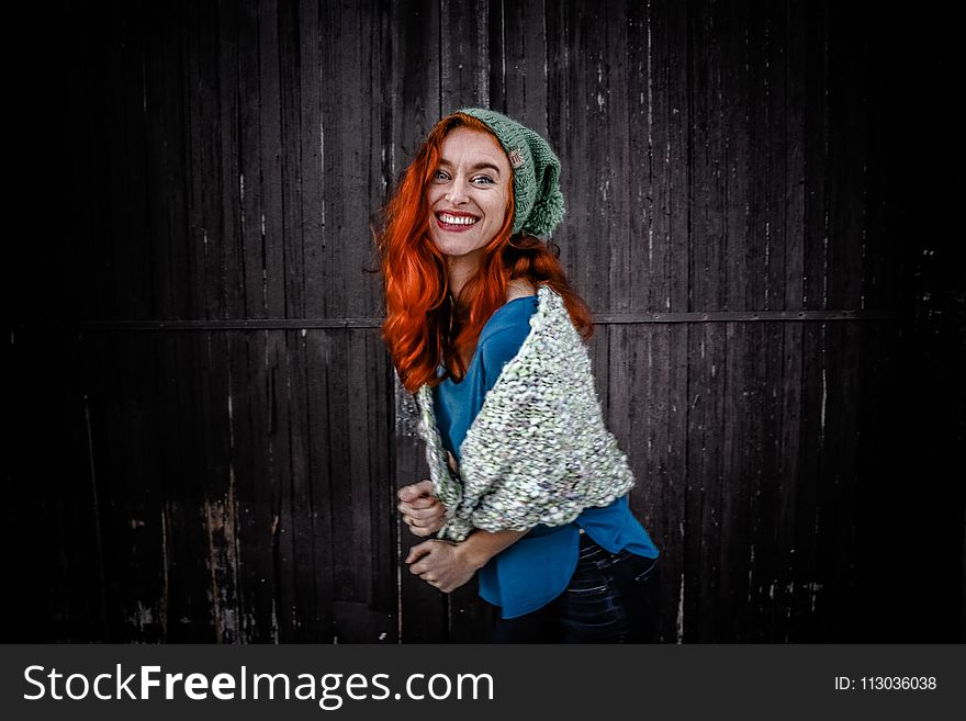 Woman in Blue Shirt an White Scarf With Red Hair