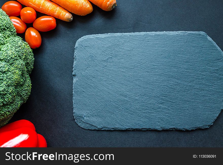 Gray Chapping Board Beside Vegetables