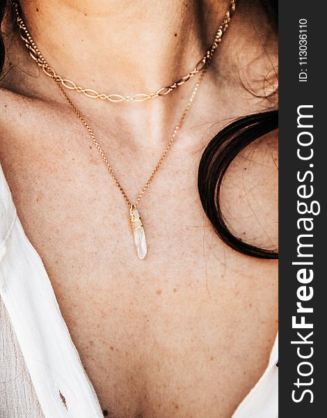 Person Wearing Gold Necklace
