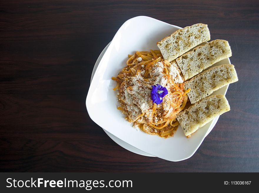 Photography of Pasta with Garlic Bread