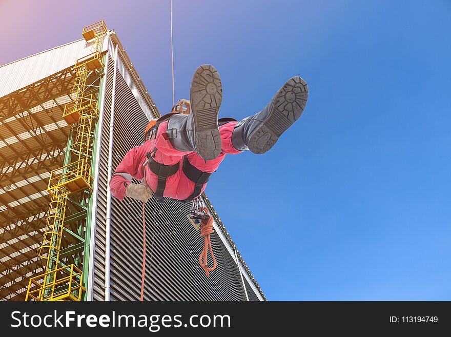 workers wear safety harness, protective equipment for the high place in ship yard and constructionbackground. workers wear safety harness, protective equipment for the high place in ship yard and constructionbackground