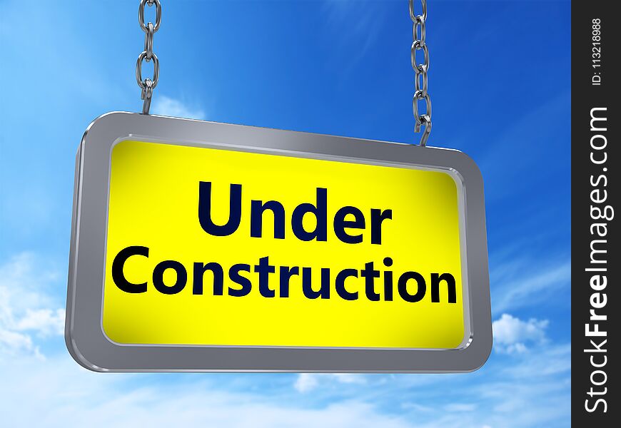 Under Construction on yellow light box billboard on blue sky background. Under Construction on yellow light box billboard on blue sky background