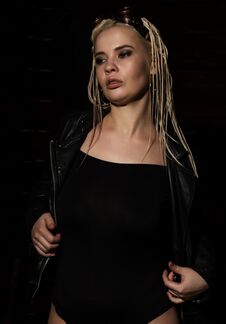 Blonde Beautiful Woman With Dreadlocks On A Dark Background In The Studio Stock Photos