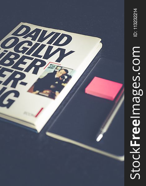 David Ogilvy Book Lying Beside Black Leather Booklet