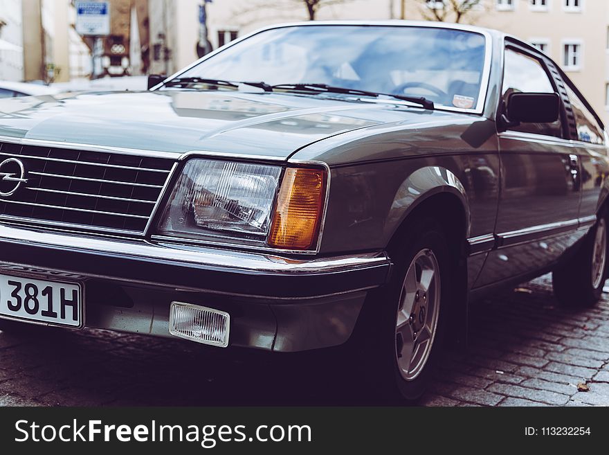 Black Opel Coupe Parked On Road