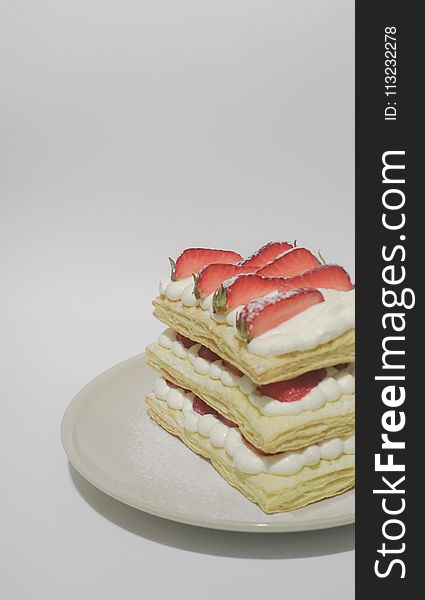 Biscuits With Cream and Sliced Strawberry Toppings