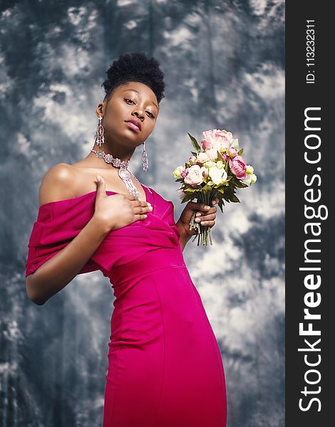 Woman in Pink Off-shoulder Dress Holding Pink and White Flower Bouquet