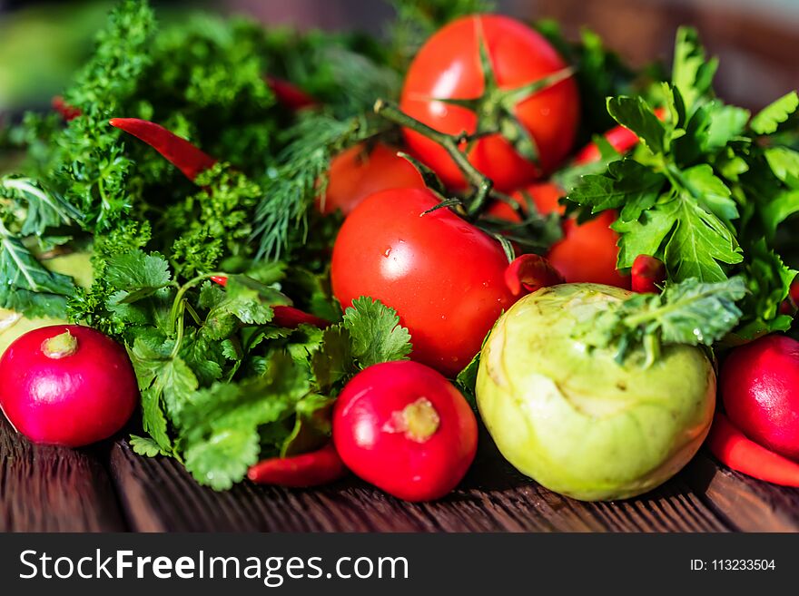 Fresh Vegetables And Herbs On Wooden Table