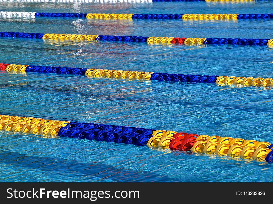 Colorful lane markers of a competitive outdoor swimming pool. Colorful lane markers of a competitive outdoor swimming pool