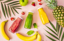 Flat-lay Of Colorful Smoothies In Bottles With Fresh Fruits. Stock Images
