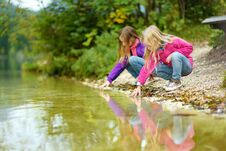 Two Little Girls Enjoying The View Of Wonderful Green Waters Of Hintersee Lake. Amazing Autumn Landscape Of Bavarian Alps On The A Royalty Free Stock Images
