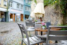 Empty Outdoor Cafe On Beautiful Rainy Autumn Day In Lindau, Germany. Empty Chiars And Tables Under Falling Rain In Autumn. Royalty Free Stock Images Empty Outdoor Cafe On Beautiful Rainy Autumn Day In Lindau, Germany. Empty Chiars And Tables Under Falling Rain In Autumn. Royalty Free Stock Images