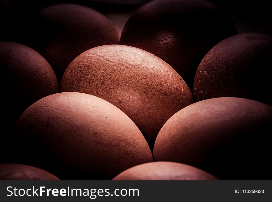 eggs colored with natural dye on brown dish, toned, vintage. eggs colored with natural dye on brown dish, toned, vintage