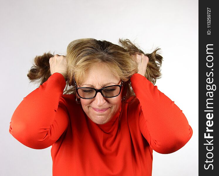 Frustrated business woman pulling her hair out