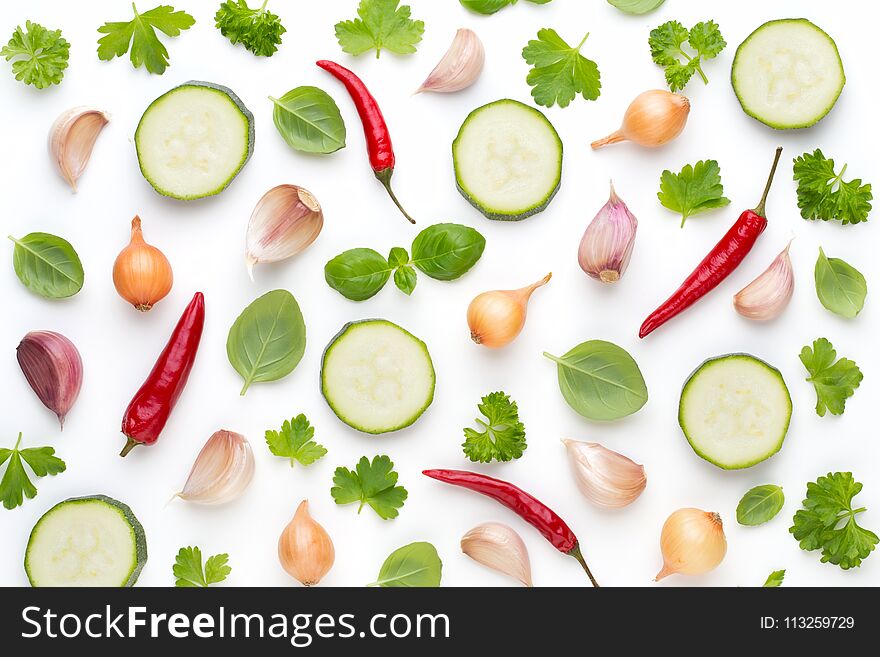 Vegetable and spices isolated on white background, top view. Wallpaper abstract composition of vegetables.