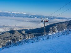 Cable Car Cabin In Bansko, Bulgaria And Snow Mountain Peaks At The Background. Blue Sky, 2017 Stock Images