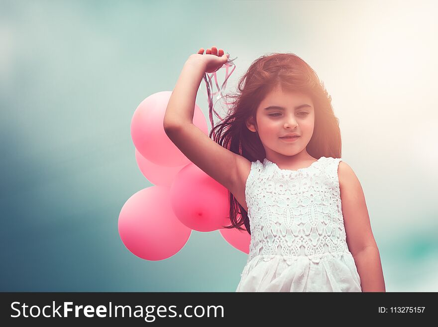 Happy girl with air balloons