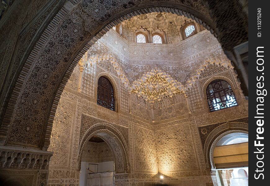 GRANADA, SPAIN - March 2018: Arches And Columns Of Alhambra. It Is A Palace And Fortress Complex Located In Granada.