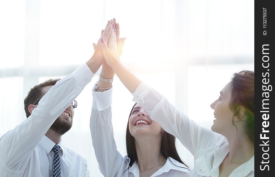 Successful Business Team Giving Each Other A High Five.