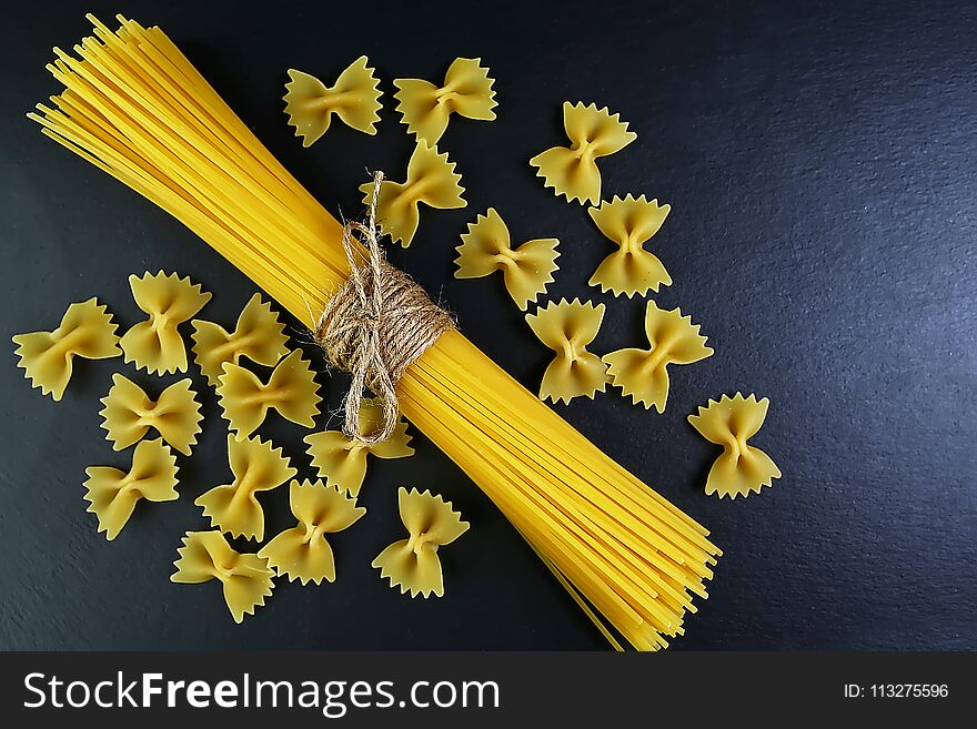 Different kinds of pasta, background of food ingredients, image of the concept of advertising in a restaurant or market, place to copy text, set.