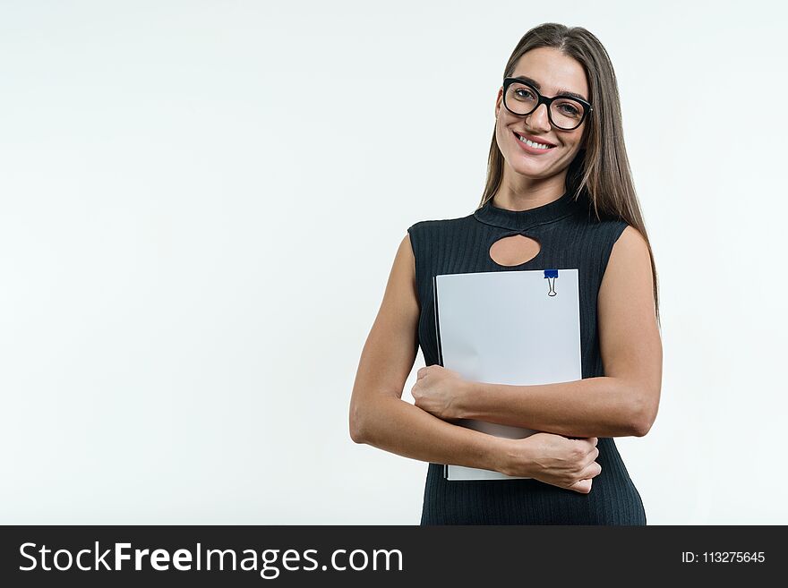 Business Woman In Glasses Black Dress Holding Document. White Background, Copy Space