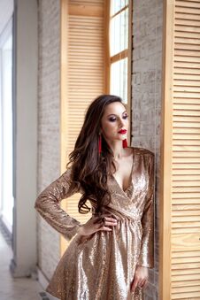 Amazing Luxury Woman In Stylish Gold Shining Party Dress . Bright Smokey Eyes Make Up, Red Full Lips, Healthy Wavy Hairs Stock Photos Amazing Luxury Woman In Stylish Gold Shining Party Dress . Bright Smokey Eyes Make Up, Red Full Lips, Healthy Wavy Hairs Stock Photos