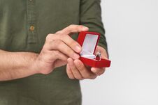 Close Up Of Male Hands Holding Wedding Ring And Gift Box. Royalty Free Stock Images