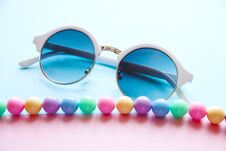 Spring Multi-colored Beads And Round White Glasses Royalty Free Stock Image