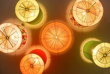 Colored Chandeliers On Ceiling In Nursery. Royalty Free Stock Images