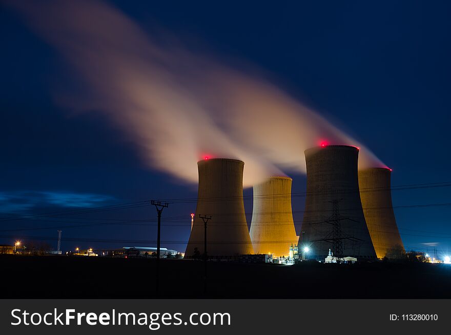 Cooling towers of nuclear power plant in the night