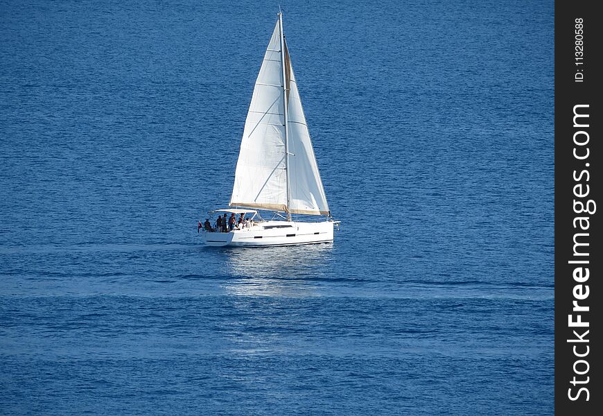 Sailboat In The Open Sea. Sailing Yacht