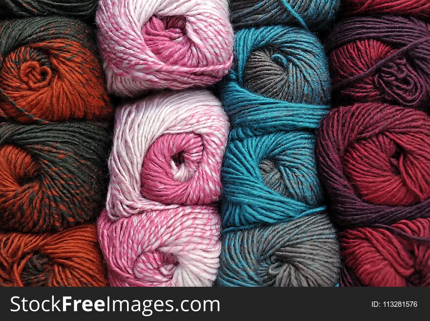 Colorful balls of wool, close up background