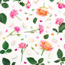Pattern With Roses, Buds, Leaves And Marshmallow With Candy On White Background. Flat Lay, Top View. Spring Background Royalty Free Stock Photos