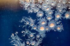 Figures On The Glass From The Frost At Sunrise As A Background Royalty Free Stock Photography Figures On The Glass From The Frost At Sunrise As A Background Royalty Free Stock Photography