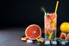 Grapefruit Lemonade. Two Glasses Of Refreshing Drink, Water With Grapefruit, Rosemary Branches And Ice. Royalty Free Stock Photo Grapefruit Lemonade. Two Glasses Of Refreshing Drink, Water With Grapefruit, Rosemary Branches And Ice. Royalty Free Stock Photo