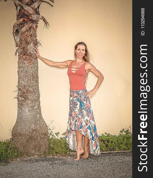 Woman Posing Near Tree