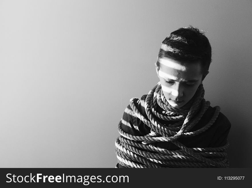 Grayscale Photography of Person Bind in Rope