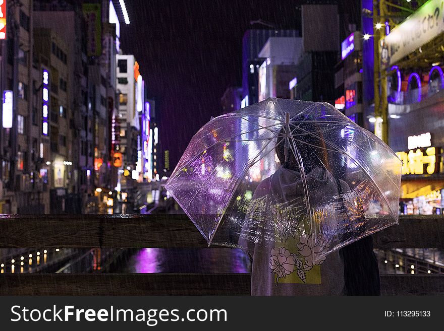 Photo of a Person Holding an Umbrella