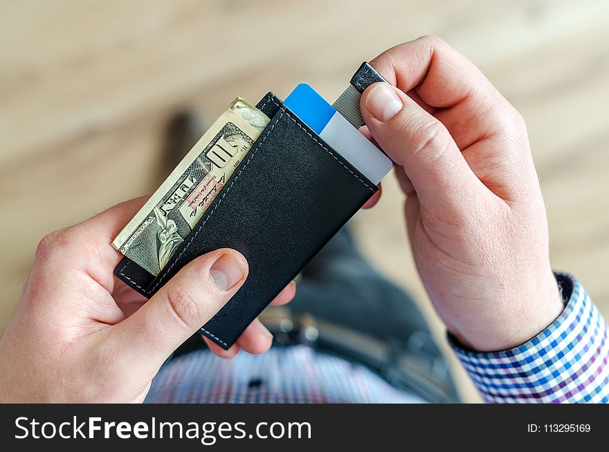 Person Holding Black Card Holder