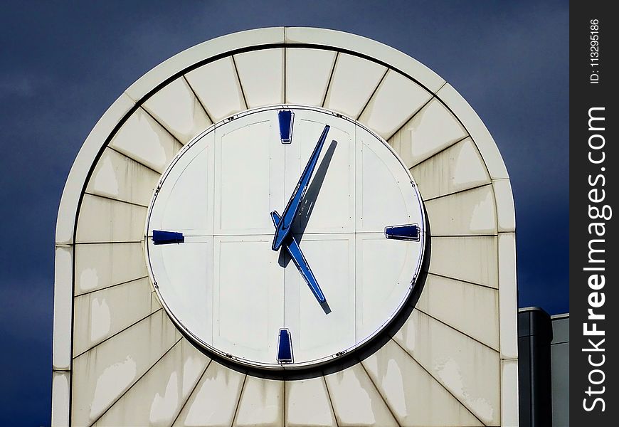 Photo of White Analog Building Clock