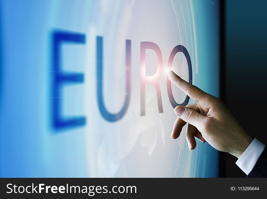 Businessman touching the screen about euro currency