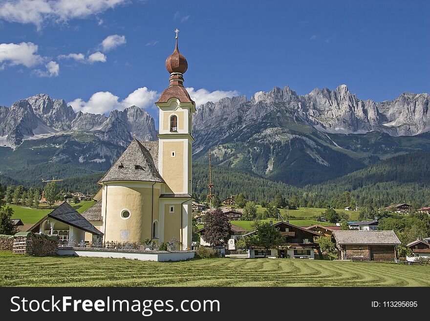 Going, idyllic village in Tyrol with the peaks of the Wilder Kaiser. Going, idyllic village in Tyrol with the peaks of the Wilder Kaiser