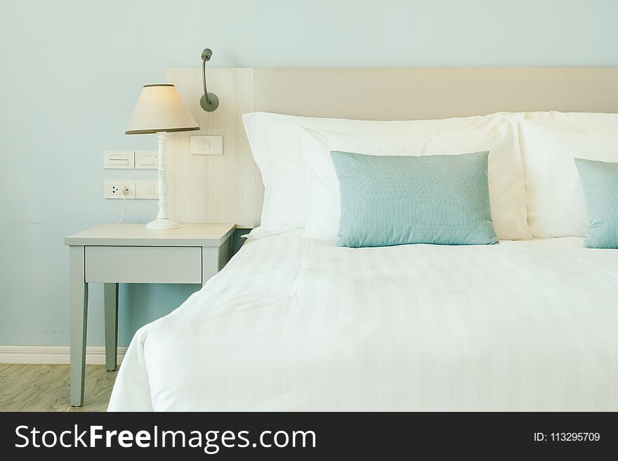 Comfortable pillow on bed decoration in hotel bedroom interior