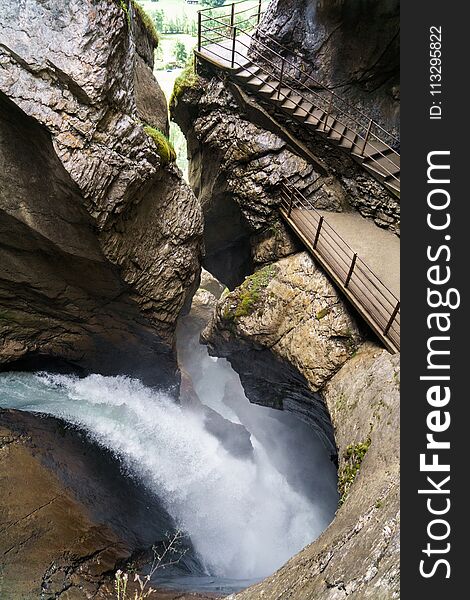 Huge Waterfall Stream In Rocks. Trummelbachfalls Waterfall In Lauterbrunnen, Switzerland.