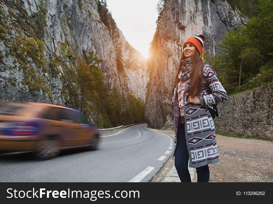 Happy Girl With Backpack In Mountains Near The Road.